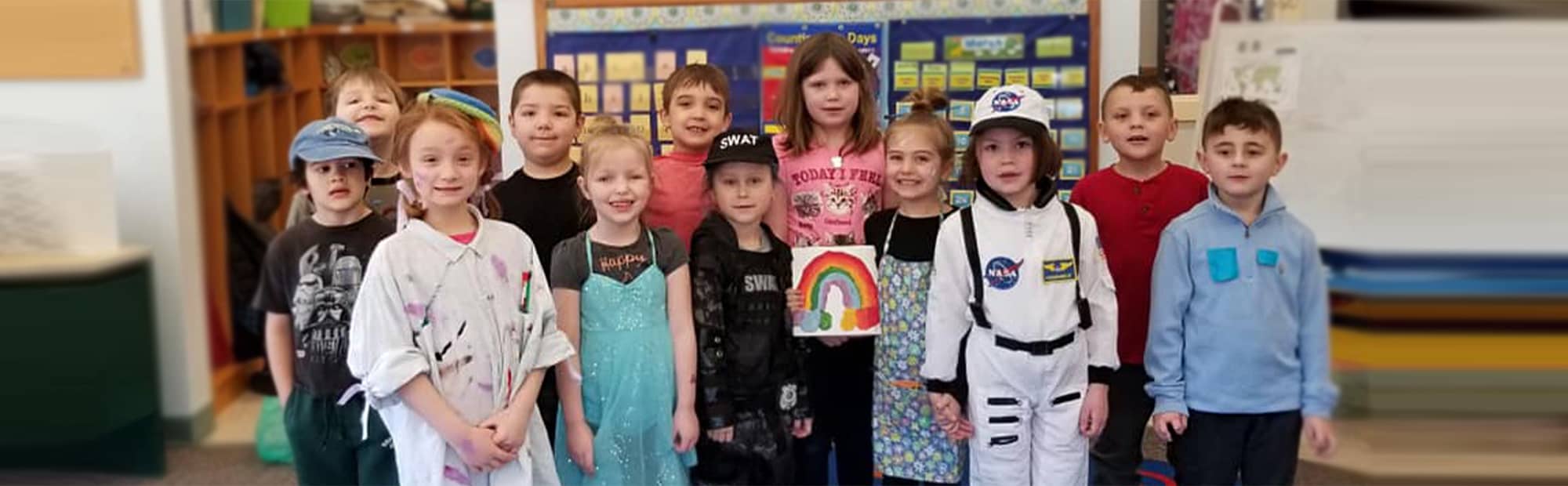 Smiling students in costumes