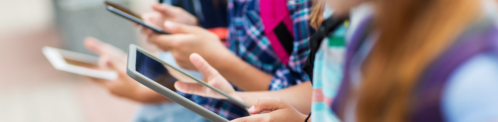 Elementary students working together with tablet computers