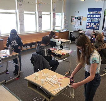 Student working on a project in the classroom