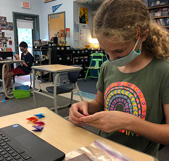 Student wearing face mask in the classroom