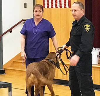 Local policeman visiting school with working dog