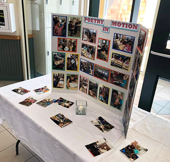 Students poem project board displayed on a table